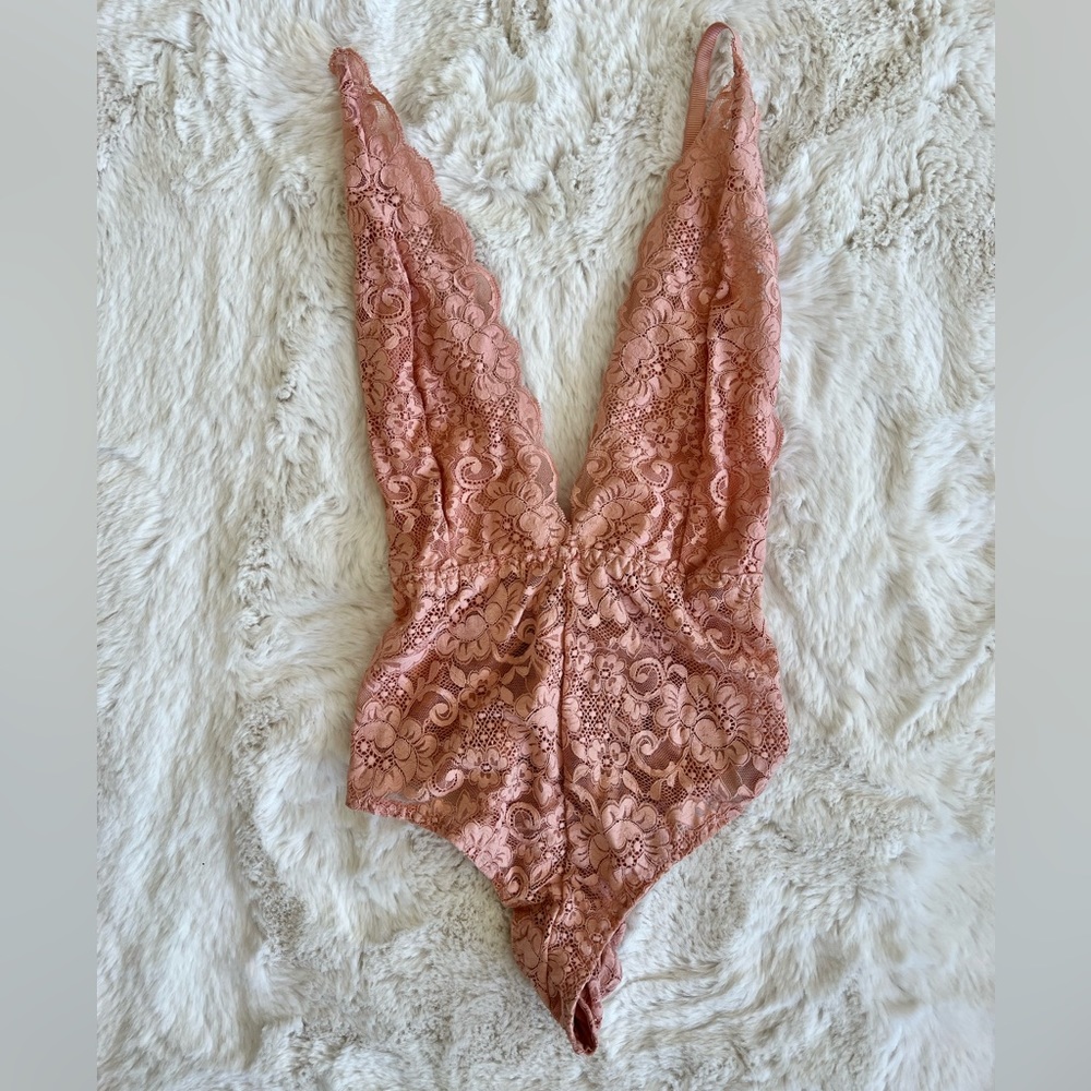 We Are Hah pink bodysuit